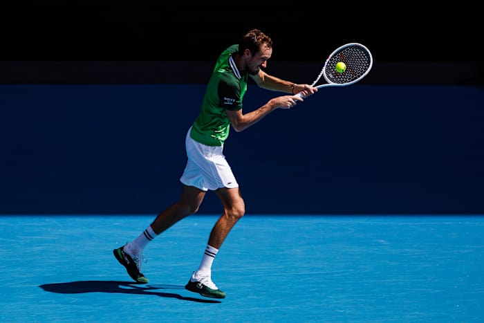 Daniil Medvedev returns a serve during the 2024 Australian Open.